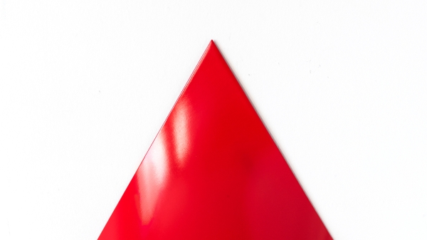 A red pylon against
                                          a white background