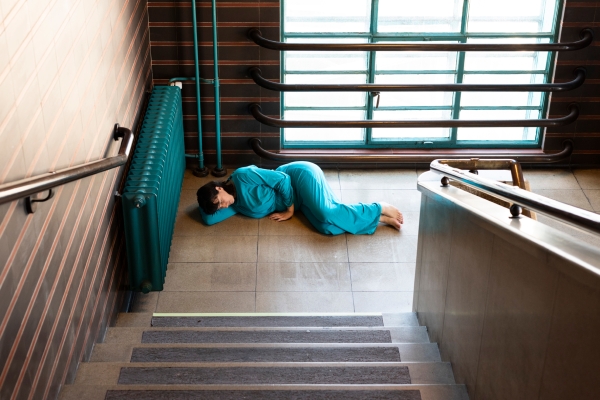 Woman lies on the floor and sleeps