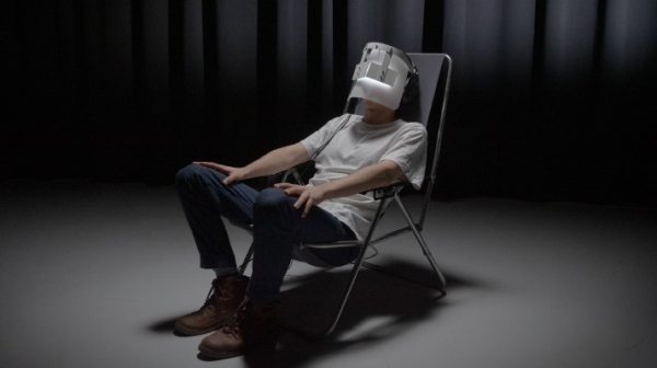 Man sitting on a chair with VR glasses